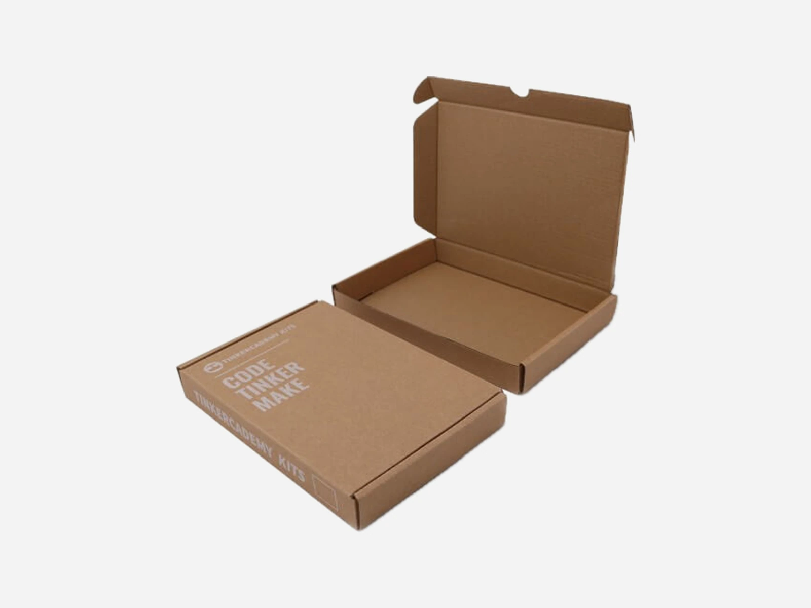 Open and closed kraft corrugated mailer boxes